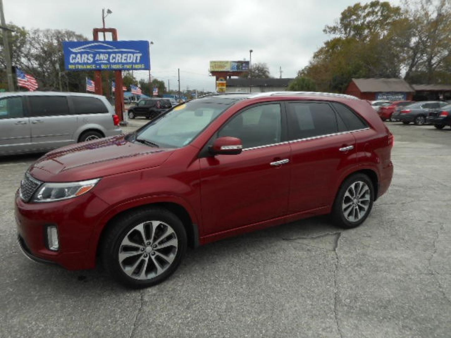 2014 RED KIA SORENTO LIMITED; SX (5XYKW4A71EG) , located at 1200 Cassat Avenue, Jacksonville, FL, 32205, (904) 695-1885, 30.302404, -81.731033 - Photo#1